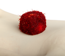 PliaFX Pak in Palm Showing Fibers and Chips soaked in blood